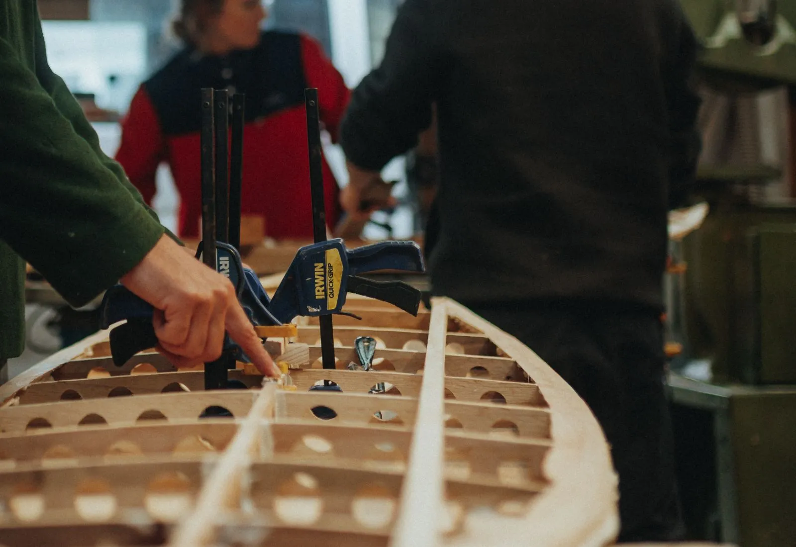 Three builders working on one frame